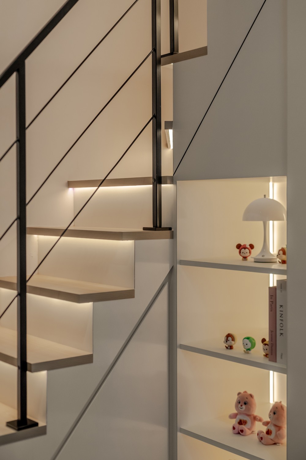 Contemporary Bedroom with Bookshelf and Staircase