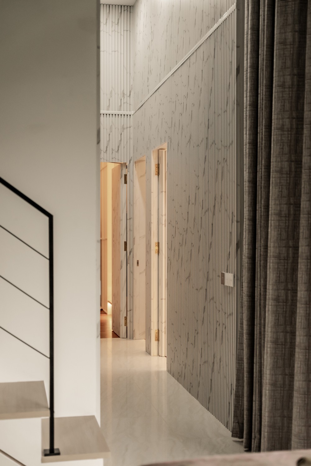 Contemporary Entryway with Feature Wall and Staircase