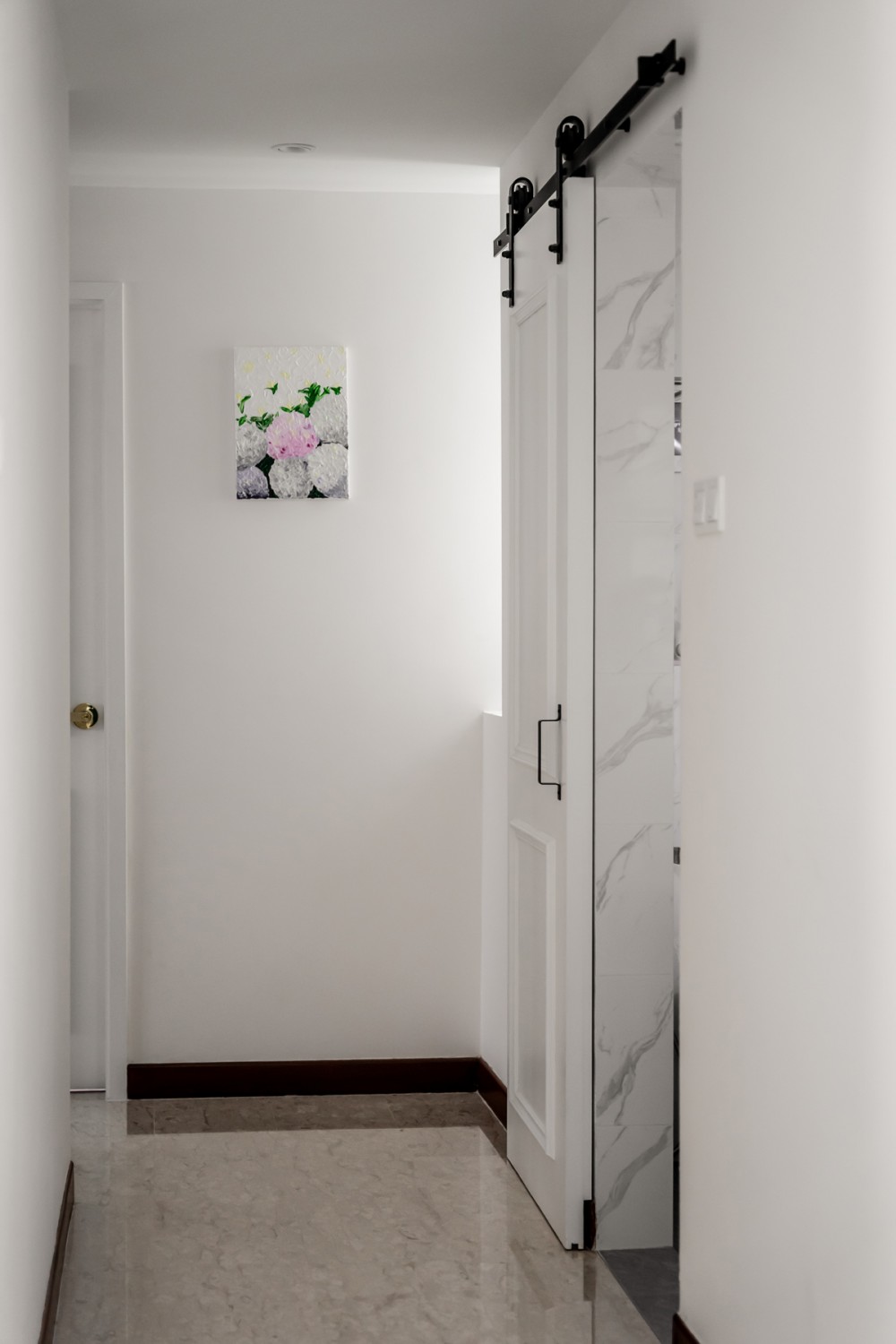 Modern Hallway with Marble Floor and Artwork