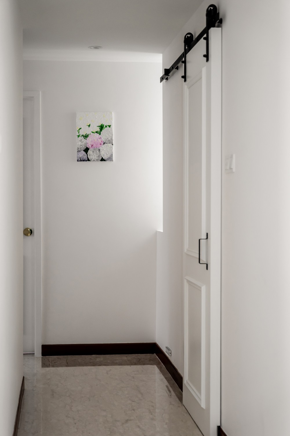 Modern Hallway with Marble Floor and Artwork