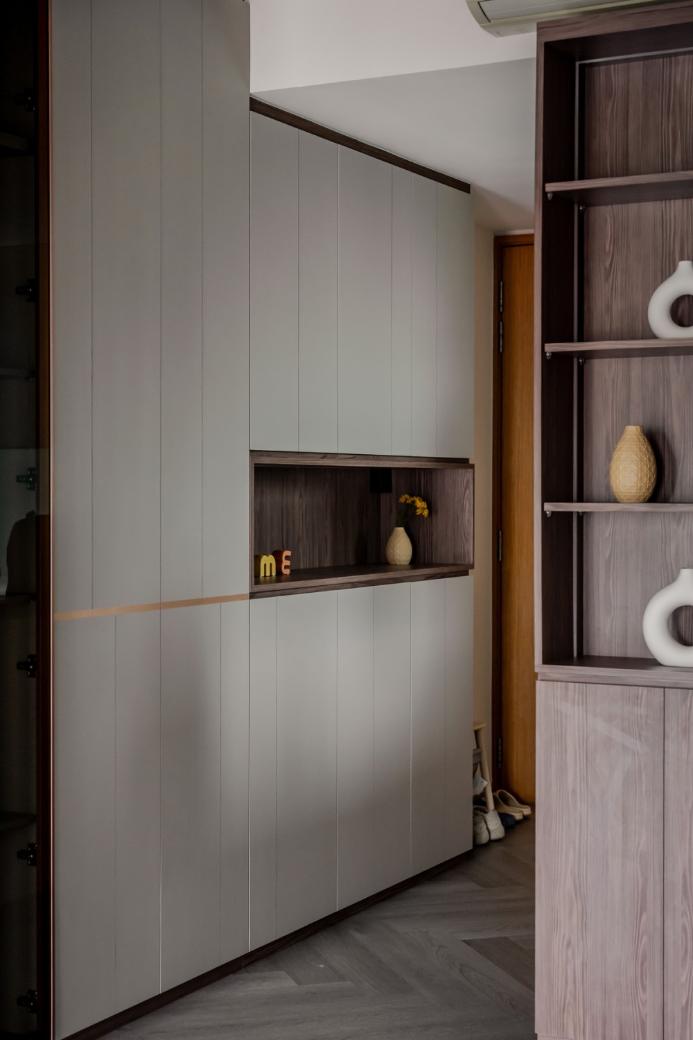 Modern Entryway with Herringbone Tiling and Small Storage