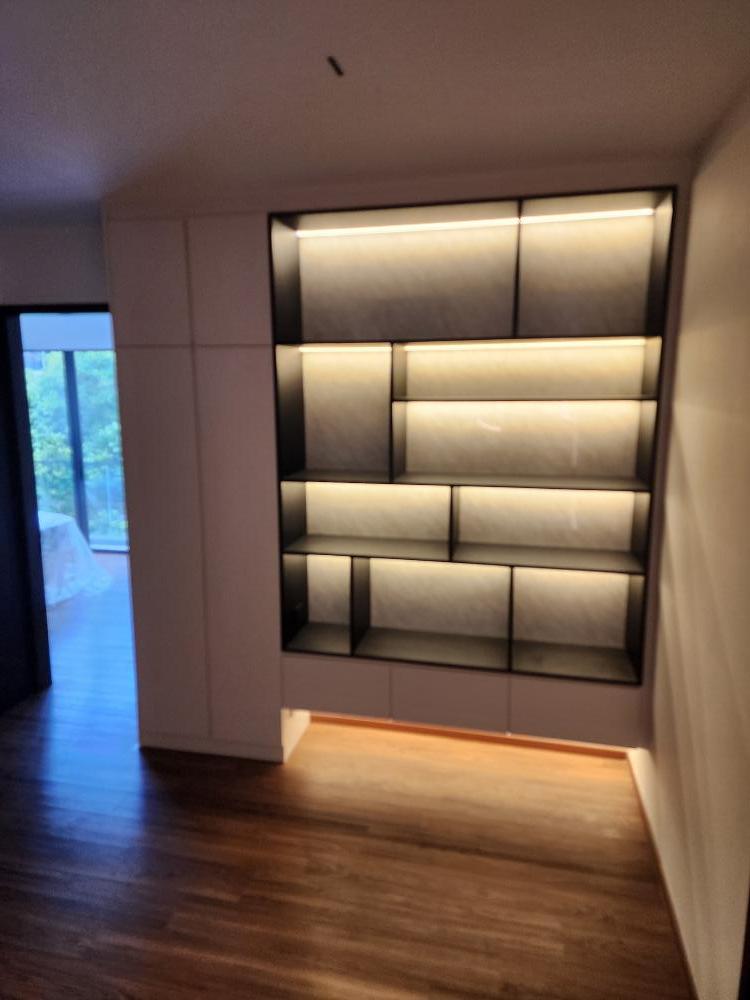 Modern Hallway with Bookshelf and Artwork