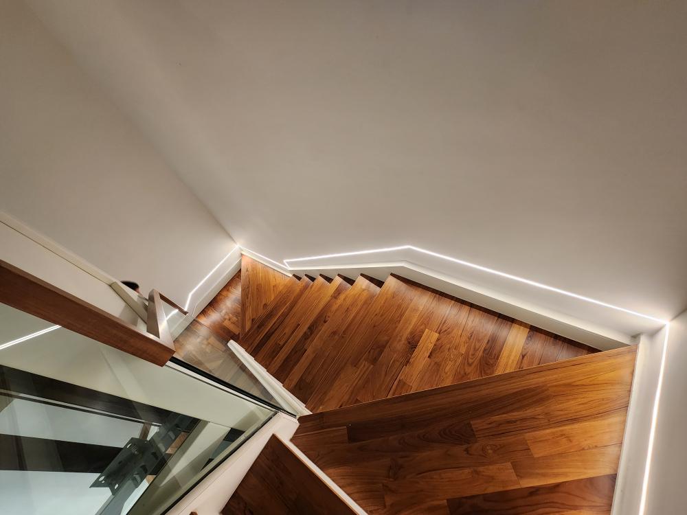 Modern Hallway with Bookshelf and Artwork
