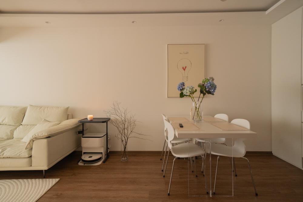 Minimalist Dining Room with Drop Light and Dining Table