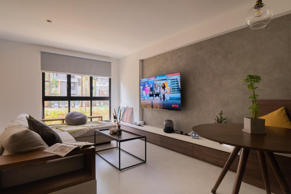 Contemporary Living Room with Bookshelf and Feature Wall