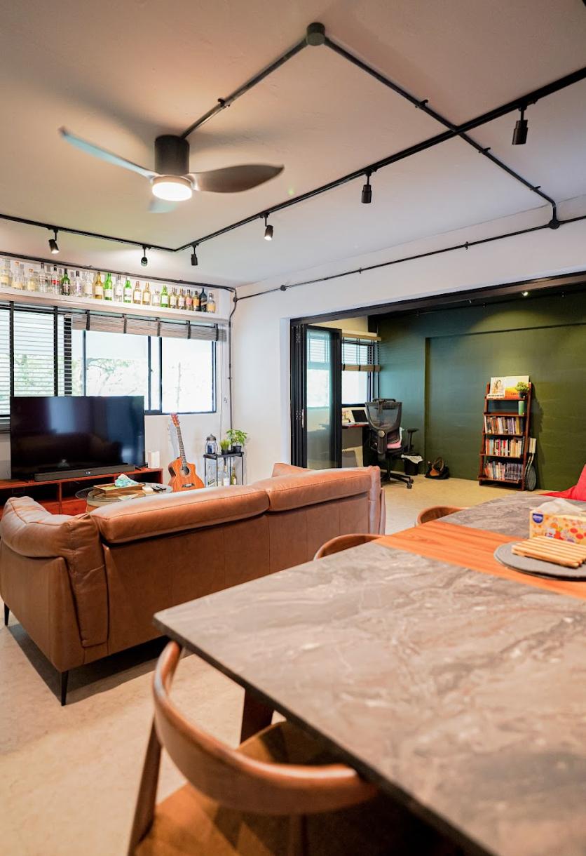 Industrial Living Room with Cement Floor and Feature Wall