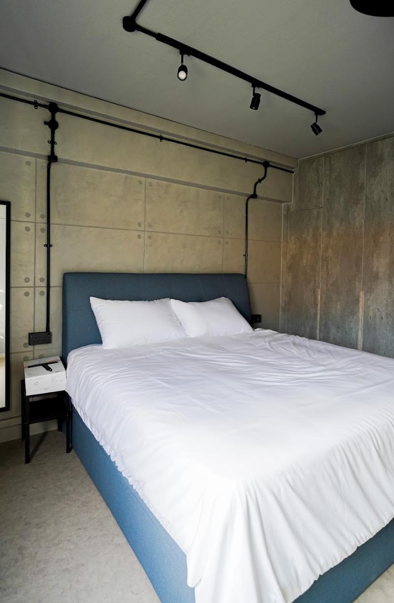 Industrial Bedroom with Homogeneous Tiles and Wardrobe