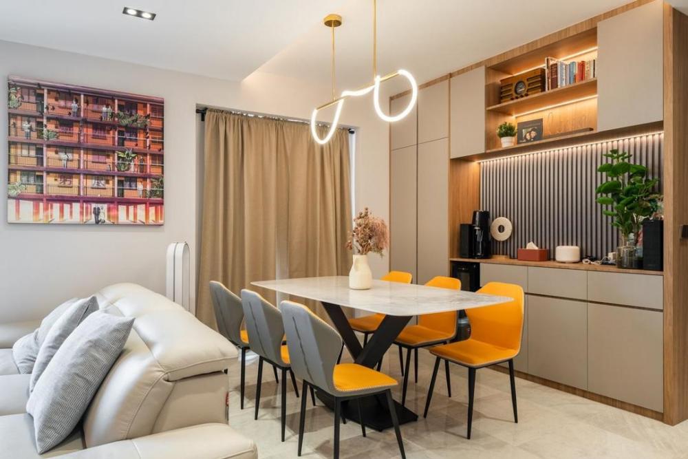 Contemporary Dining Room with Feature Wall and Drop Light