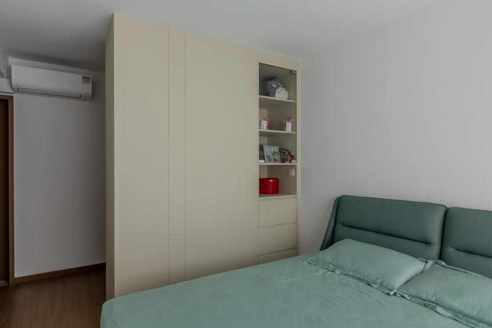 Minimalist Bedroom with Bookshelf and Wood Flooring