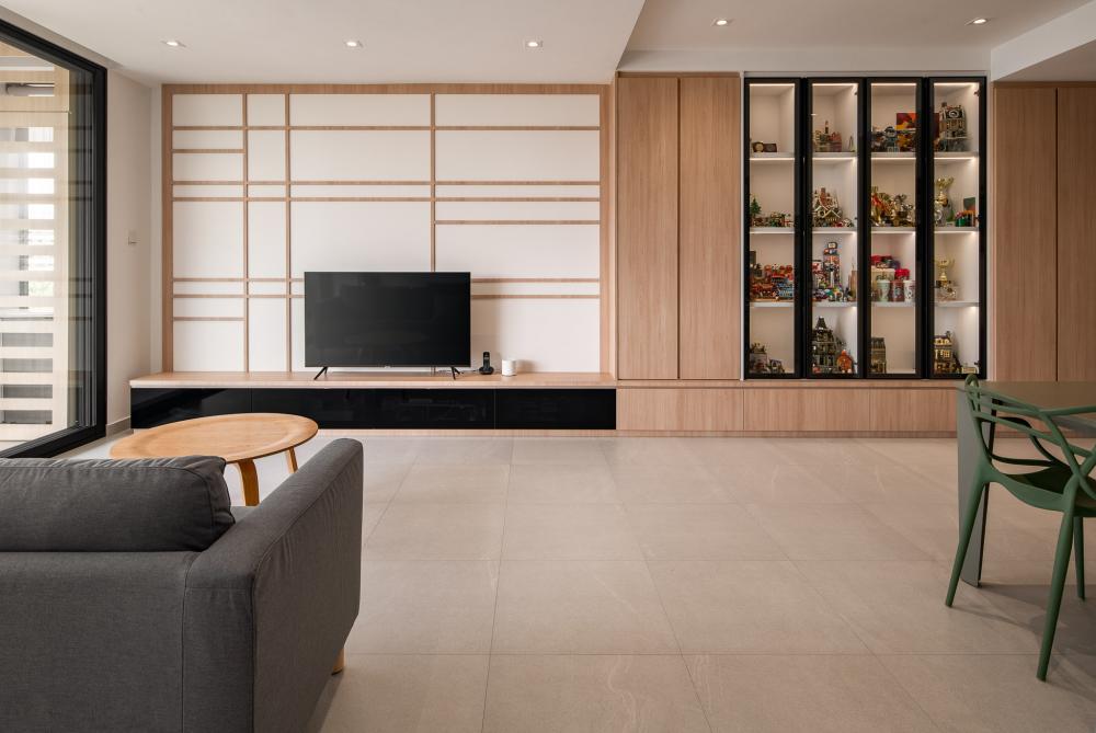 Scandinavian Living Room with Bookshelf and Homogeneous Tiles
