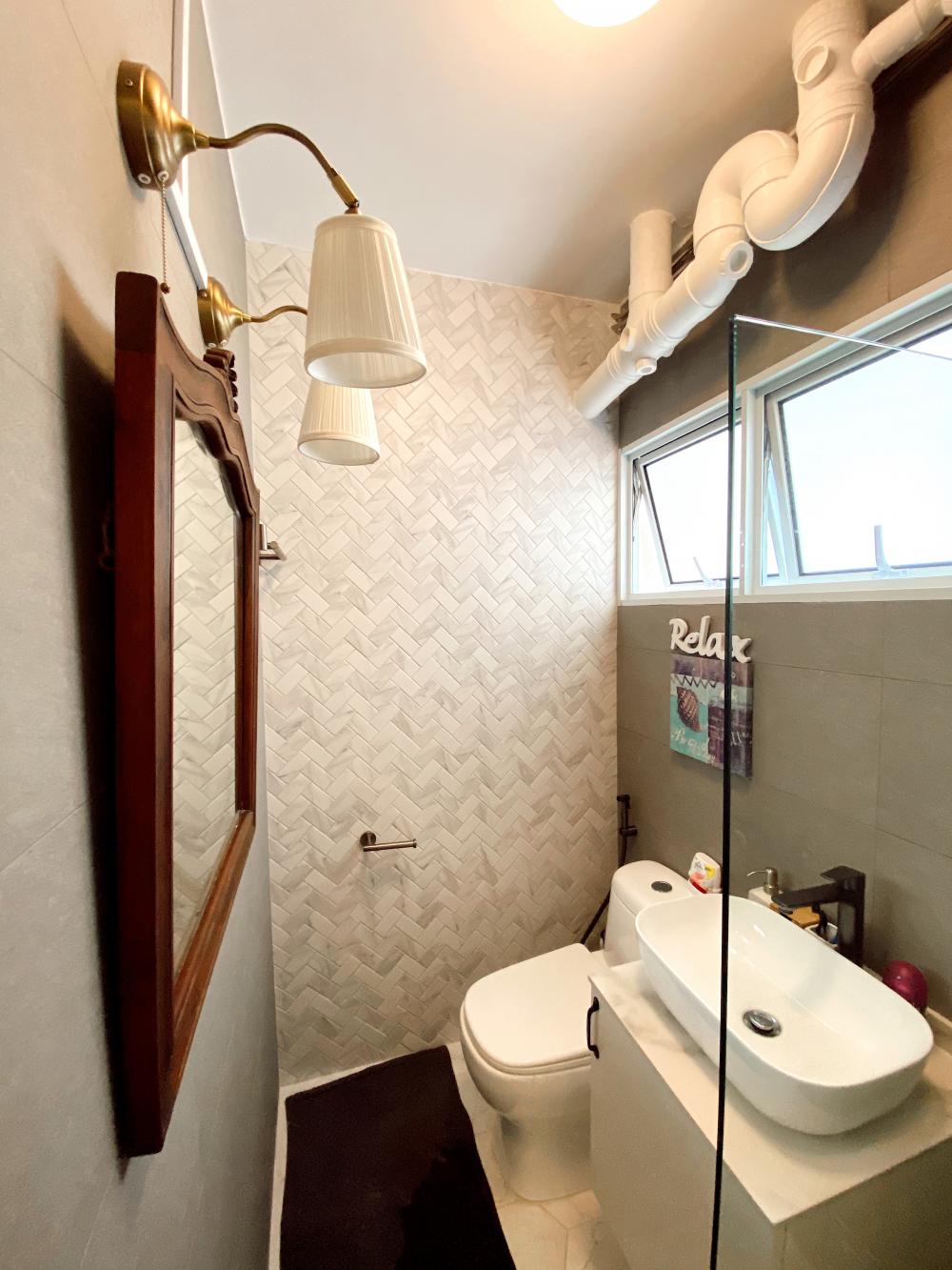 Vintage Bathroom with Herringbone Tiling and Vanity Counter