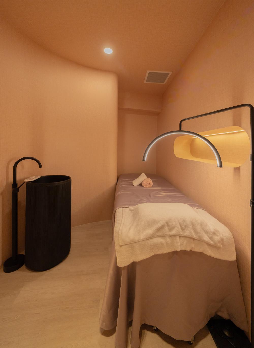 Modern Bedroom with Wood Flooring and Ceiling Light