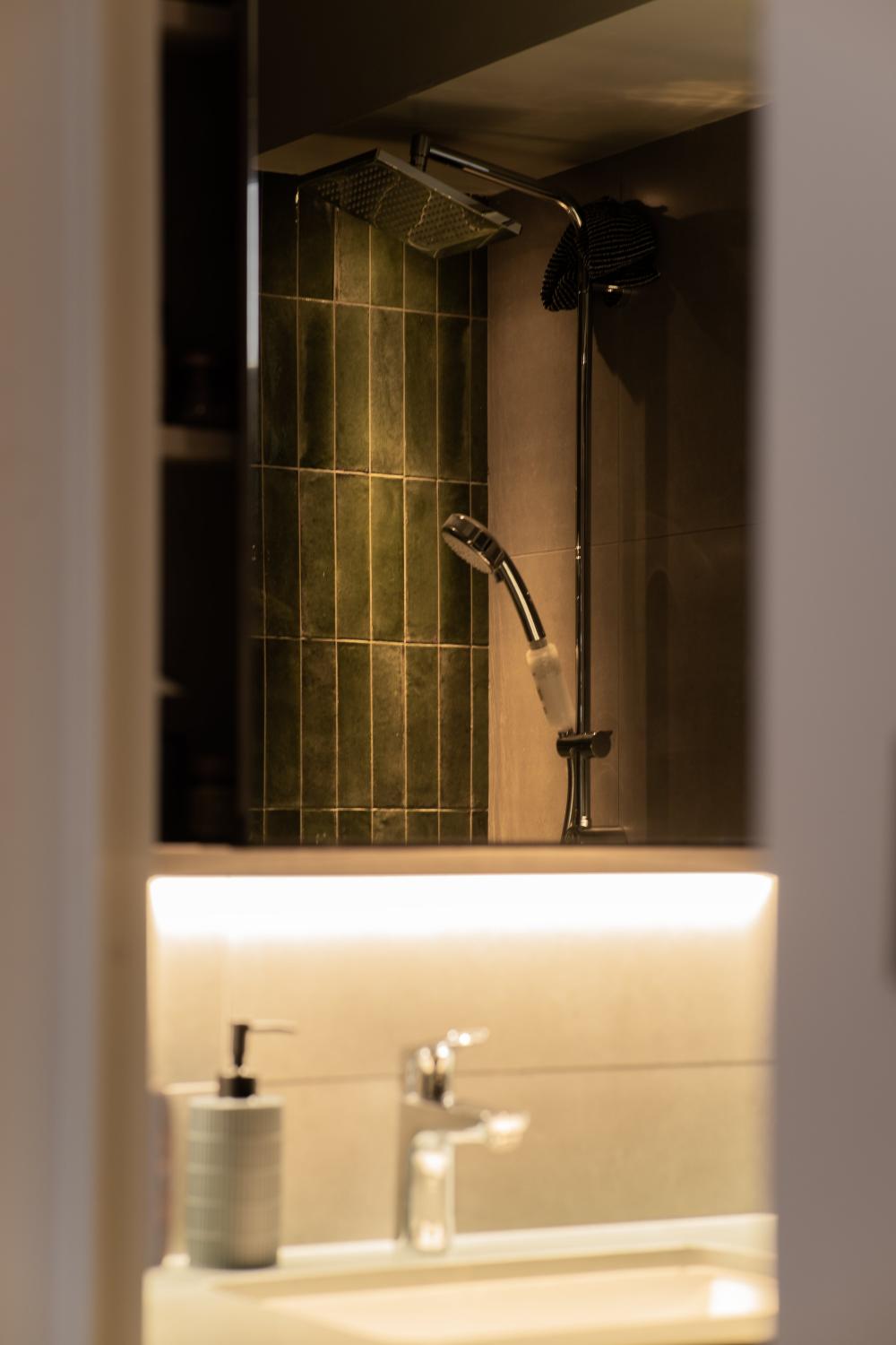 Scandinavian Bathroom with Herringbone Tiling and Mirror