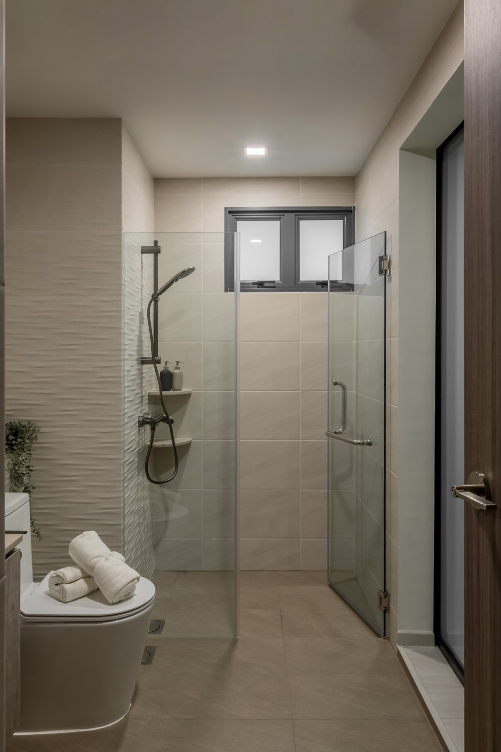 Modern Bathroom with Homogeneous Tiles and Glass Door