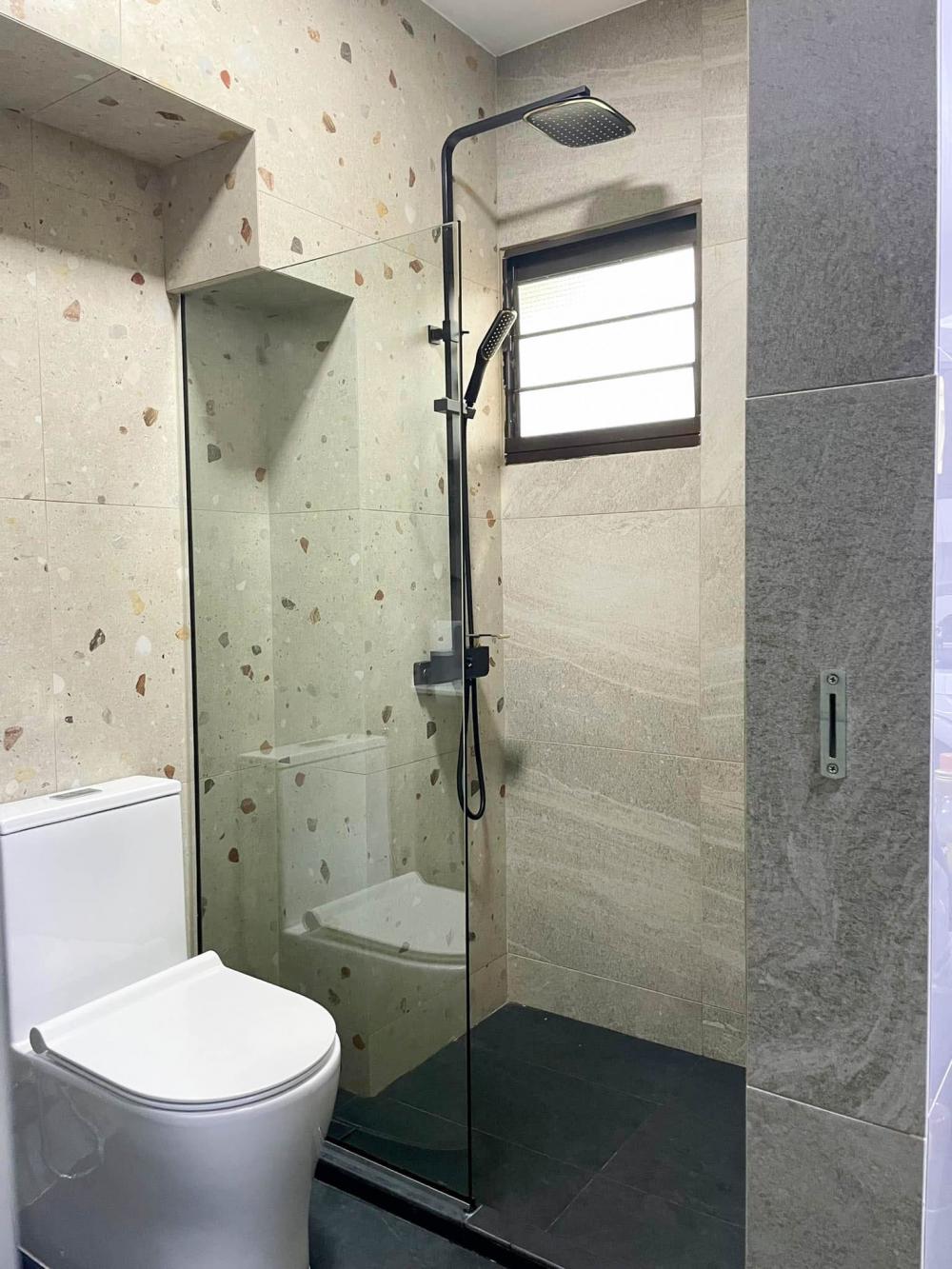 Transitional Bathroom with Feature Wall and Glass Door
