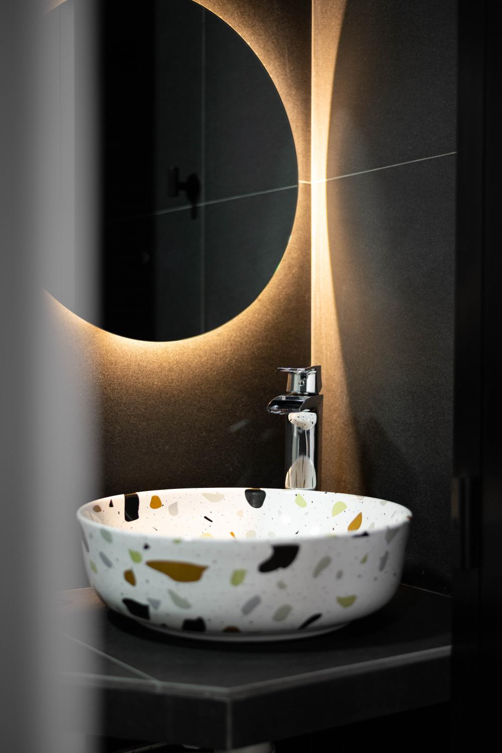 Industrial Bathroom with Homogeneous Tiles and Mirror