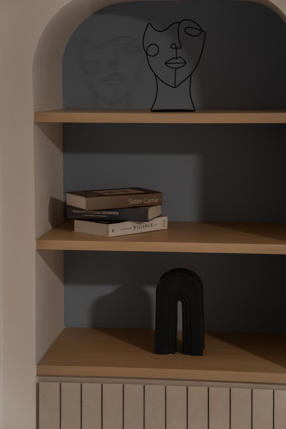 Minimalist Living Room with Bookshelf and Feature Wall