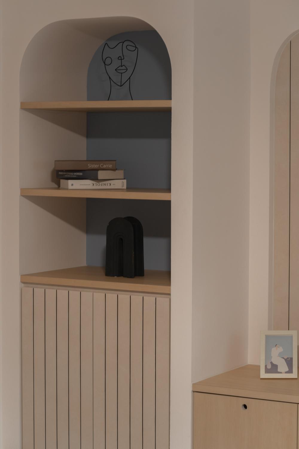 Minimalist Living Room with Bookshelf and Feature Wall