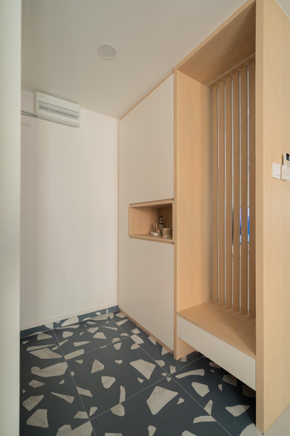 Minimalist Foyer with Artwork and Shoe Rack
