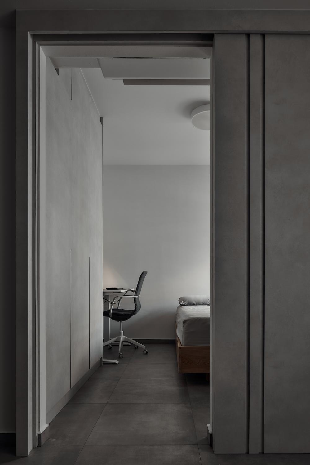 Industrial Bedroom with Cement Floor and Closet
