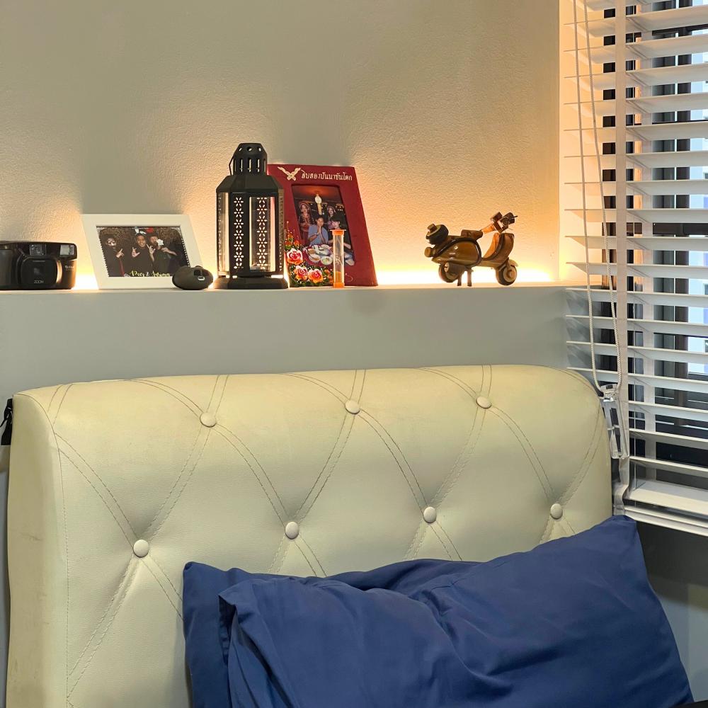 Vintage Bedroom with Paintings and Wall Shelves