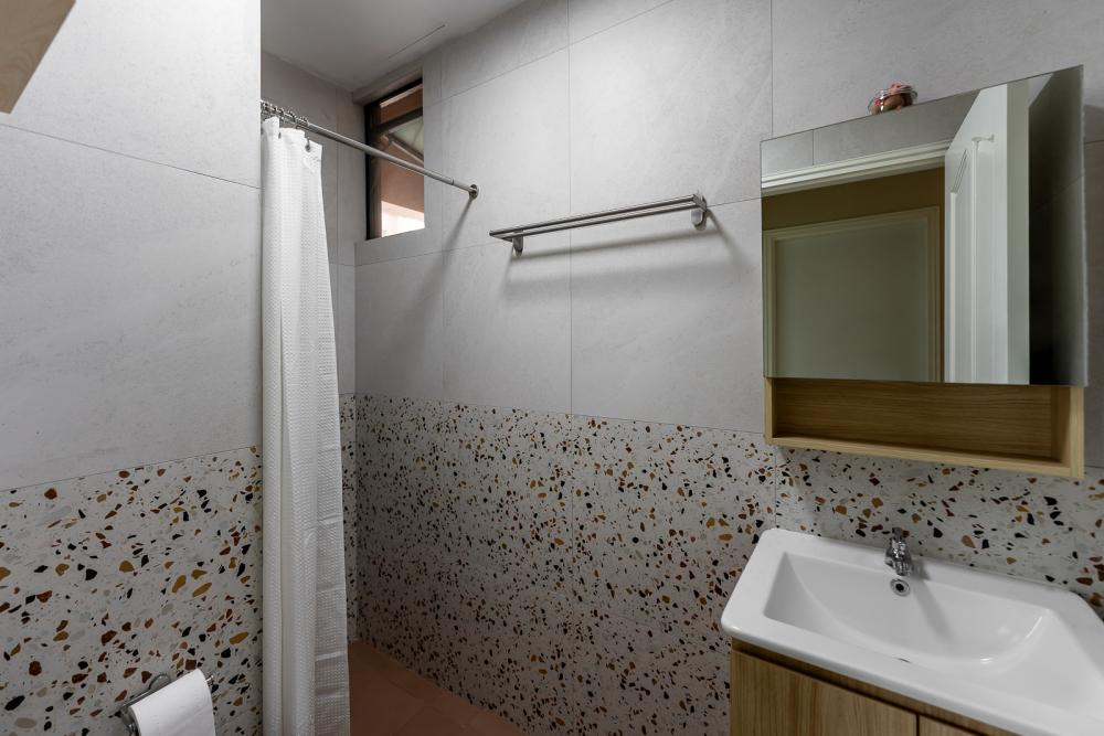 Vintage Bathroom with Homogeneous Tiles and Mirror