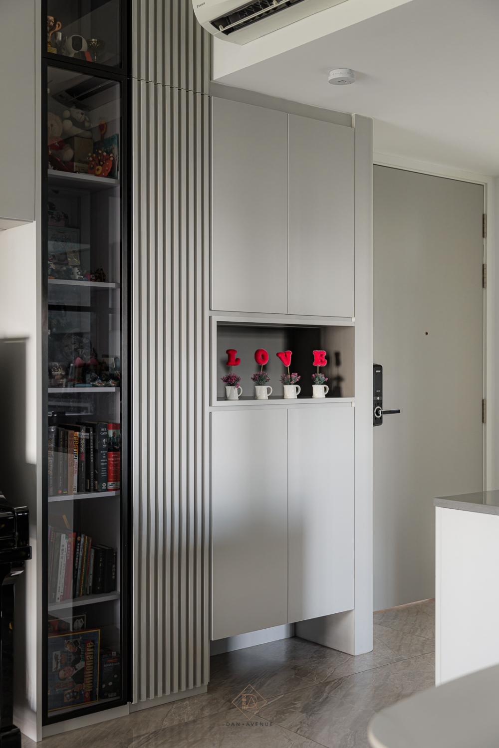 Modern Living Room with Bookshelf and Homogeneous Tiles