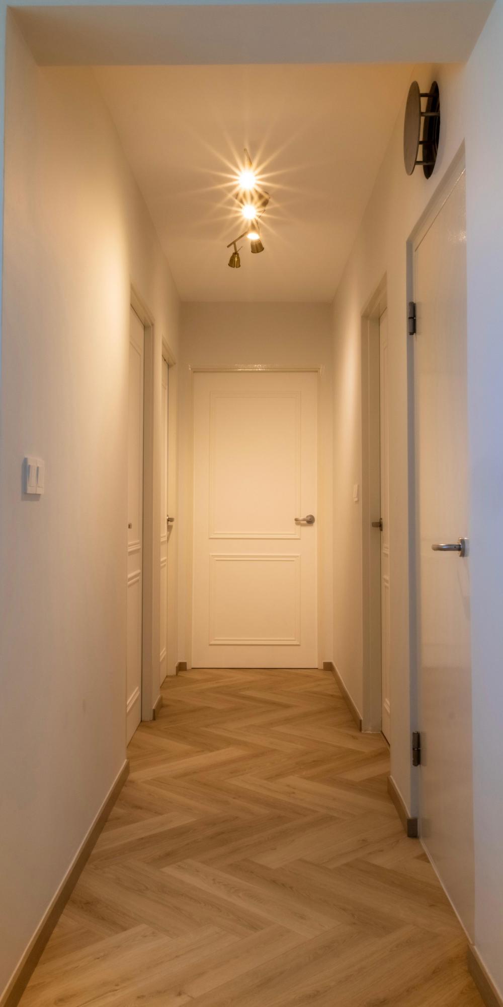 Minimalist Hallway with Vinyl Flooring and Paintings