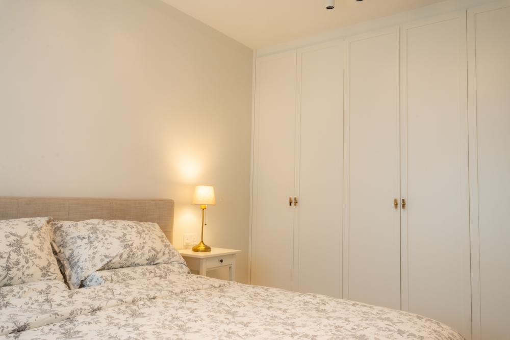 Minimalist Bedroom with Vinyl Flooring and Wardrobe