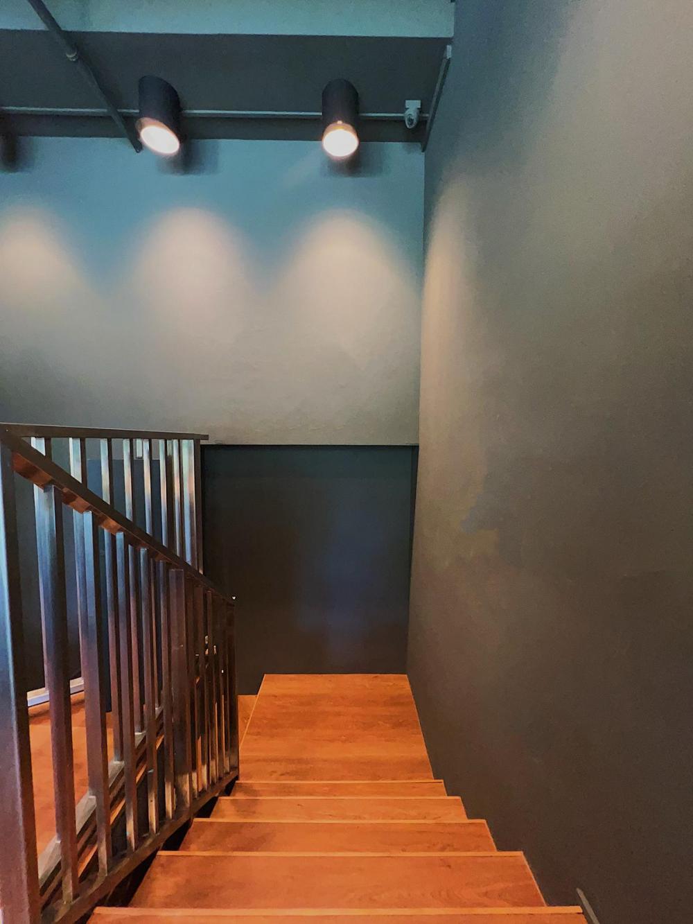 Industrial Entryway with Vinyl Flooring and Staircase