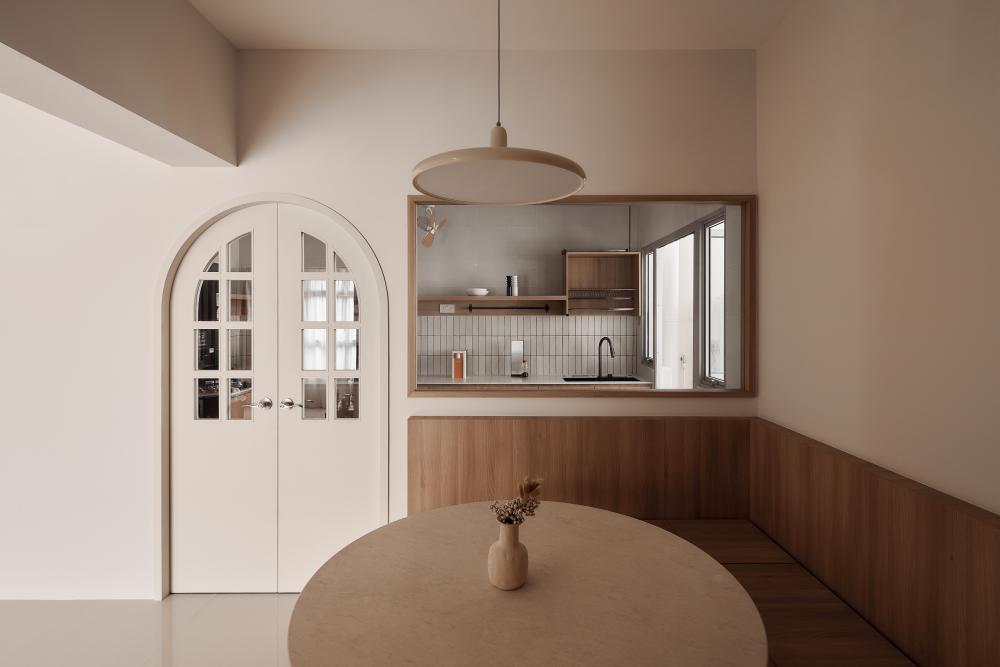 Minimalist Dining Room with Drop Light and Glass Door