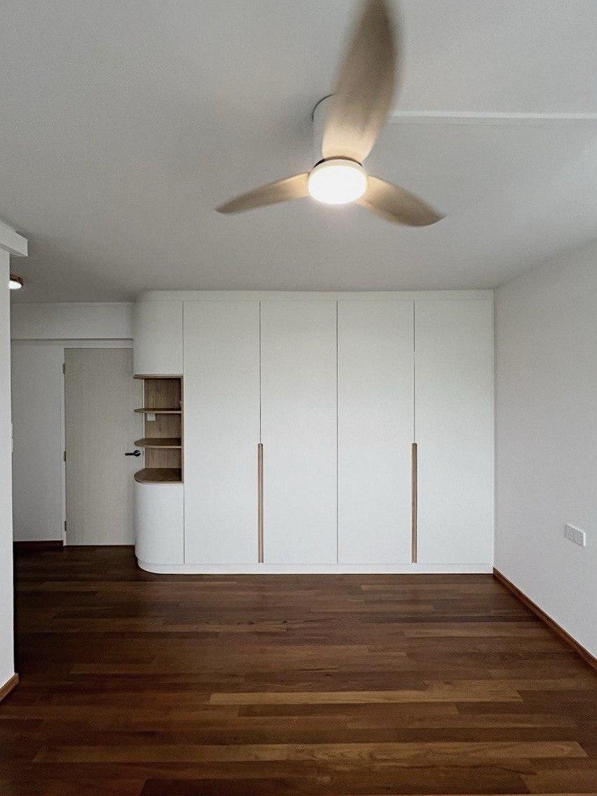 Minimalist Bedroom with Bookshelf and Parquet Floor