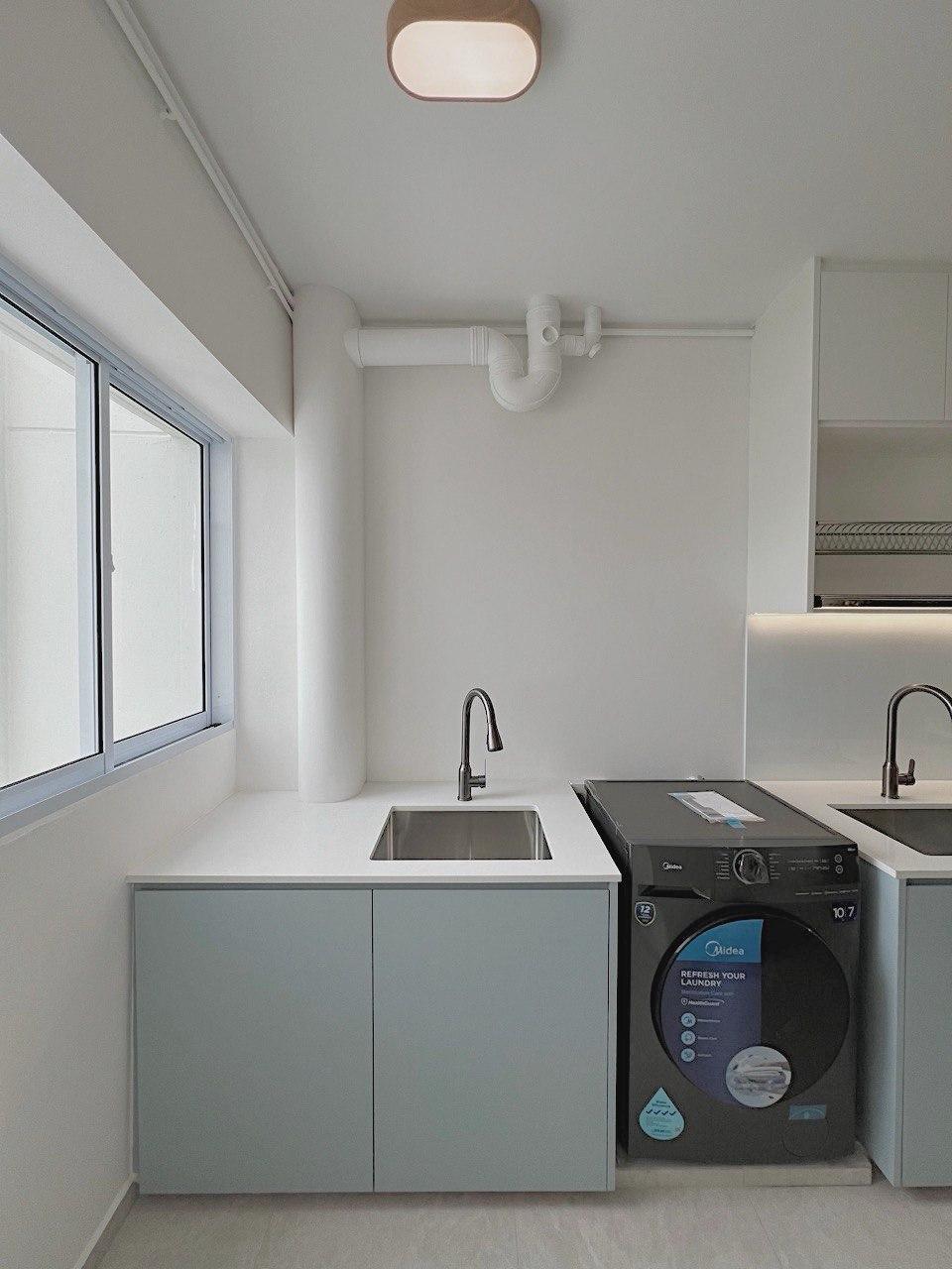 Minimalist Service Yard with Washing Machine and Laundry Area