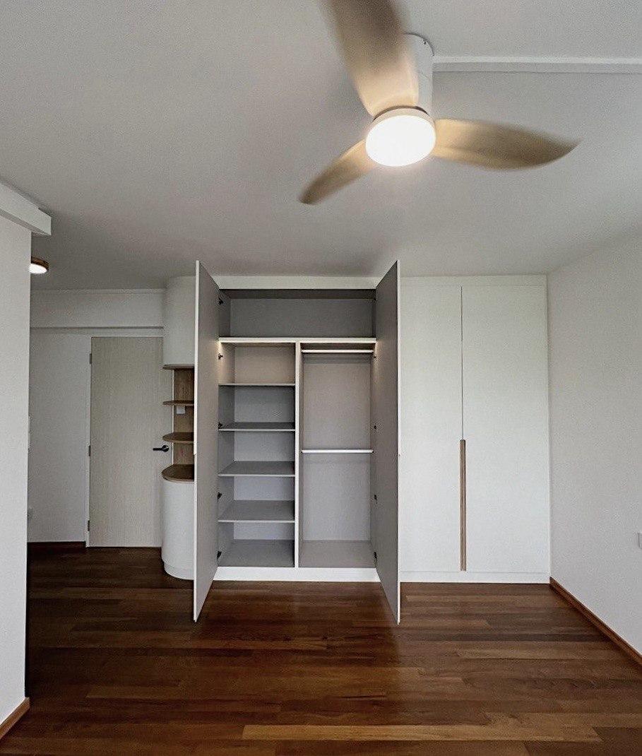 Minimalist Bedroom with Bookshelf and Parquet Floor