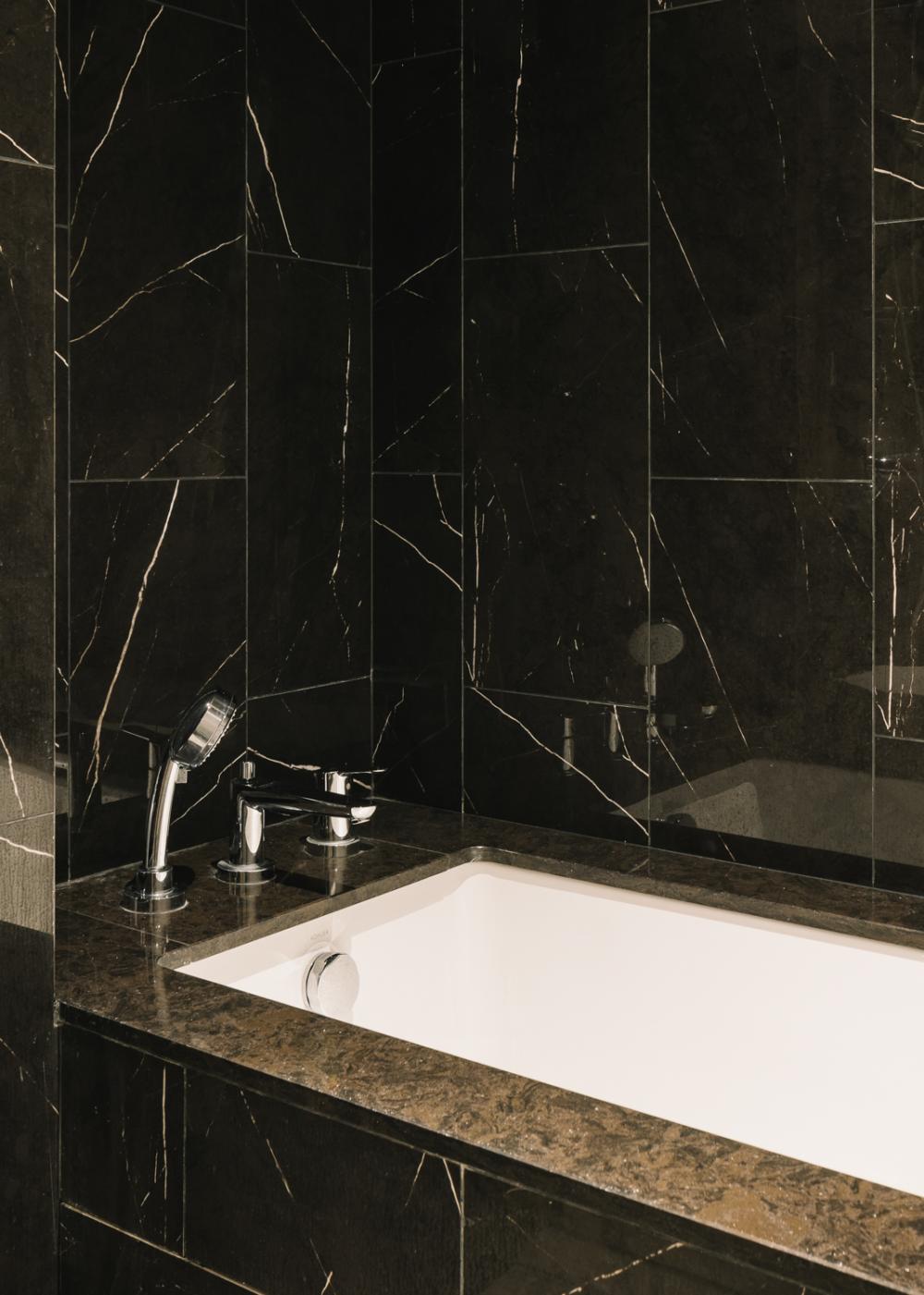 Modern Bathroom with Granite Floor and Bathtub