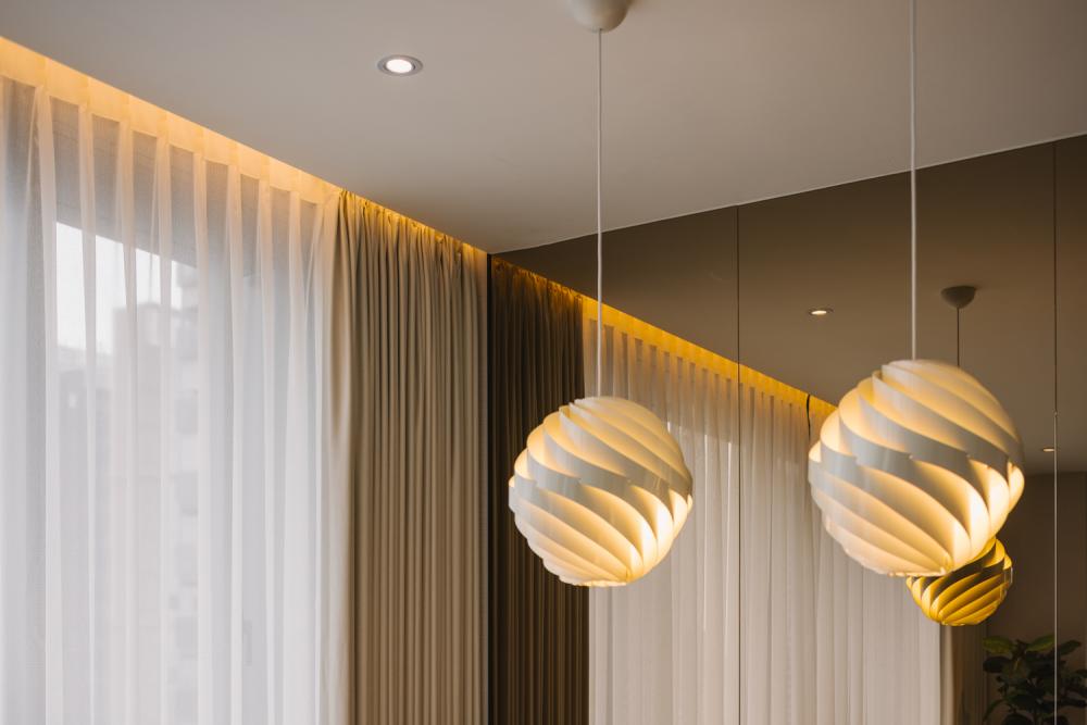 Modern Dining Room with Drop Light and Mirror