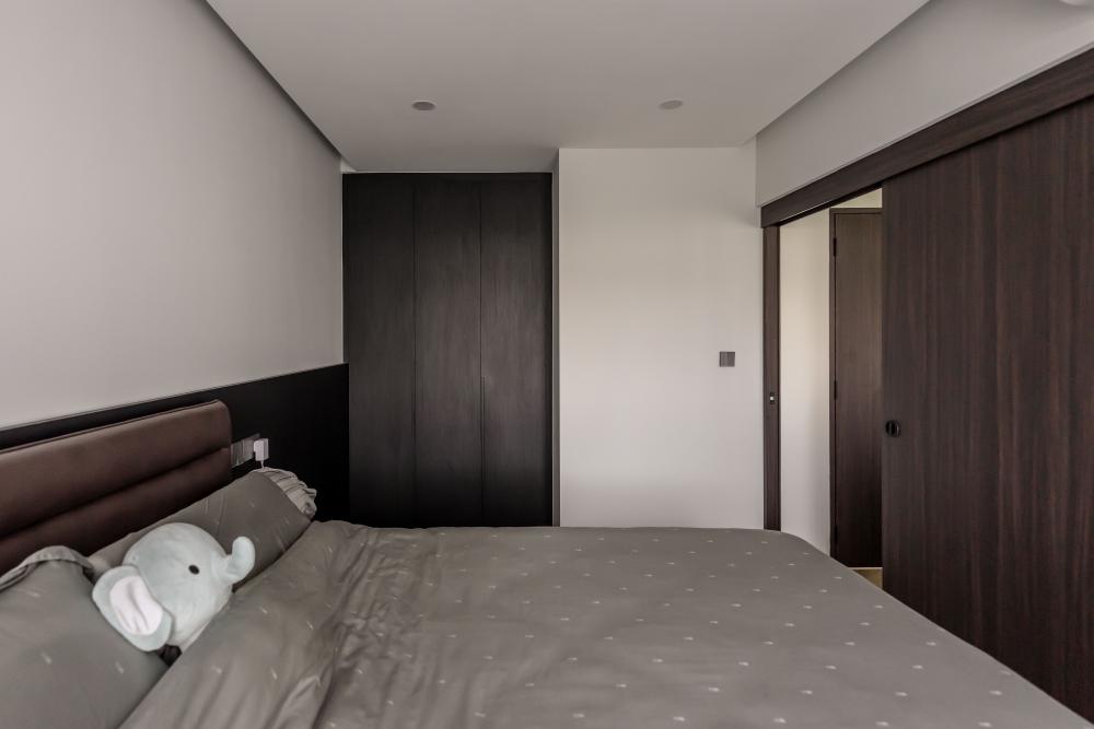 Contemporary Bedroom with Herringbone Tiling and Cove Lighting