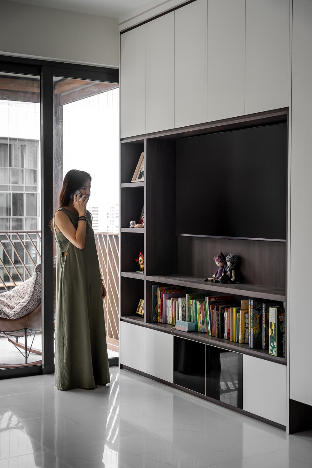 Modern Living Room with Bookshelf and Homogeneous Tiles