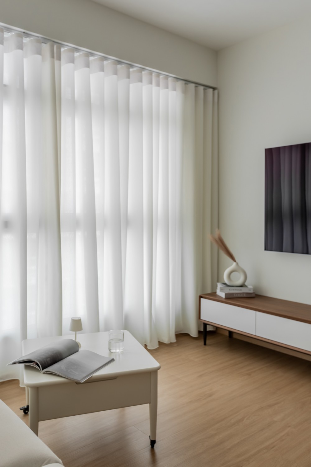 Scandinavian Living Room with TV Console and Curtain