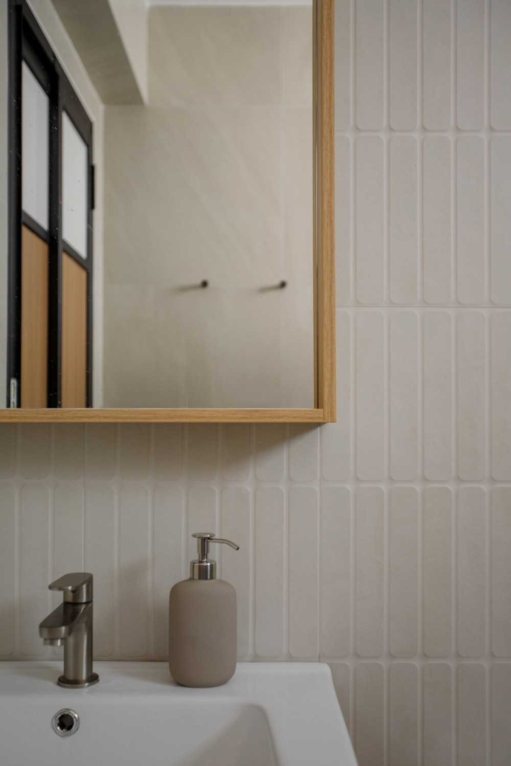 Scandinavian Bathroom with Homogeneous Tiles and Mirror