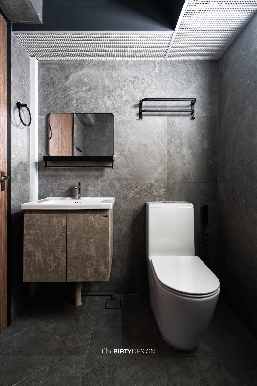 Industrial Bathroom with Homogeneous Tiles and Mirror