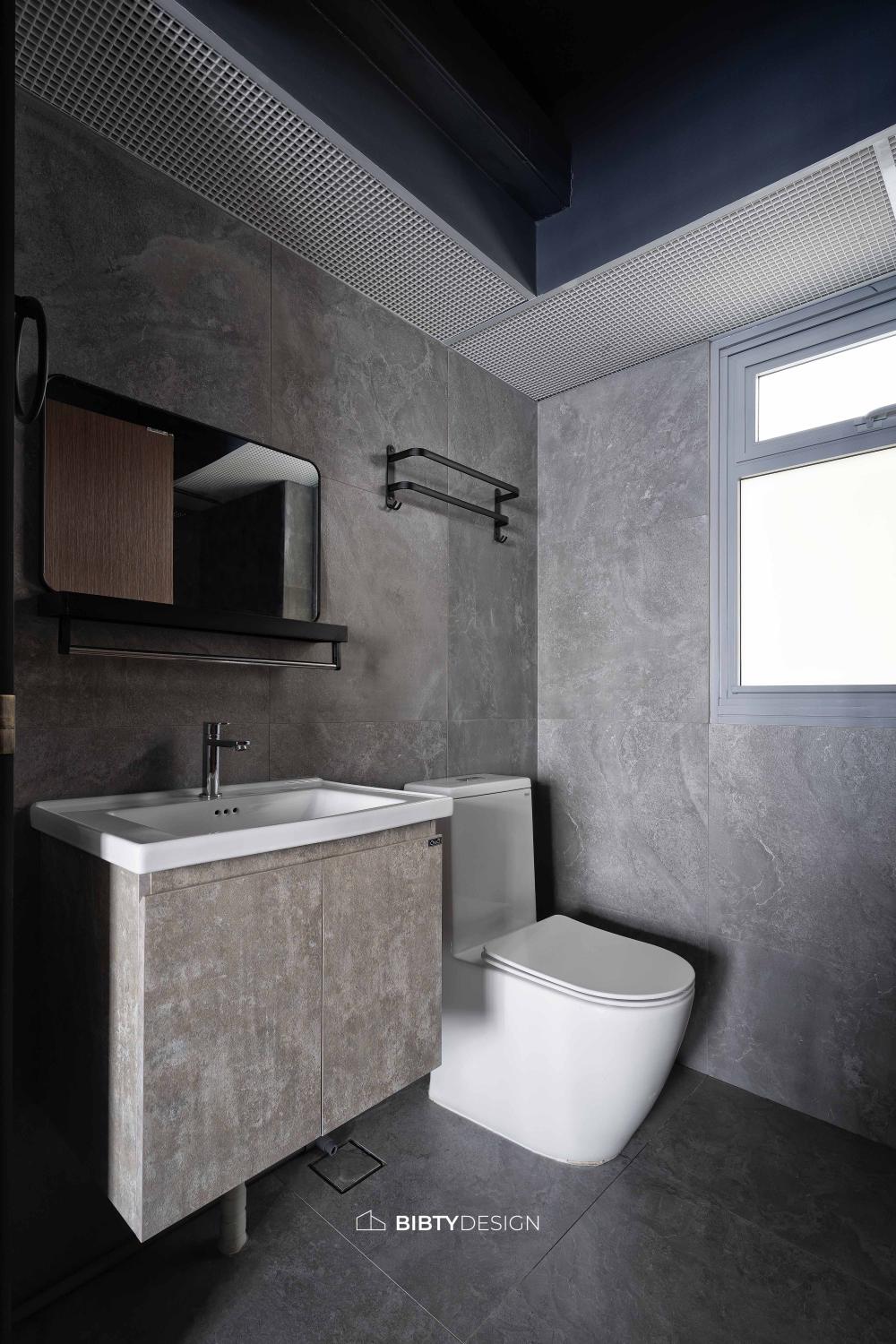 Industrial Bathroom with Homogeneous Tiles and Mirror