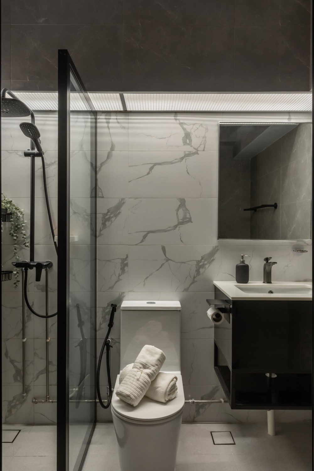 Minimalist Bathroom with Homogeneous Tiles and Shower Screen
