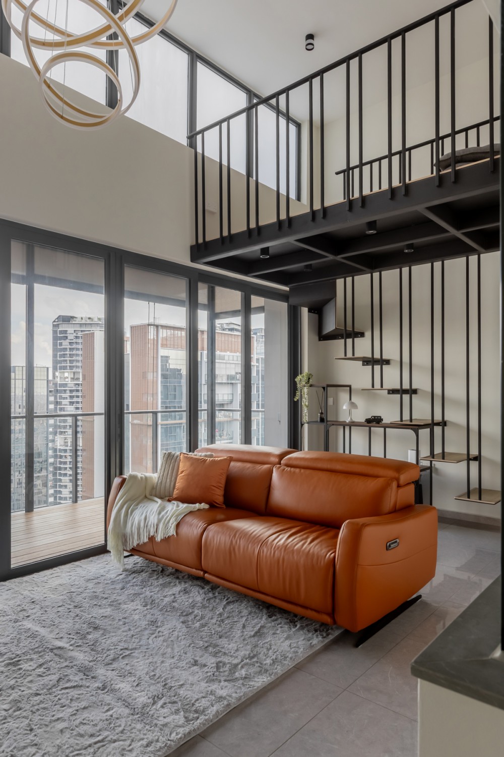 Modern Living Room with Staircase and Glass Door