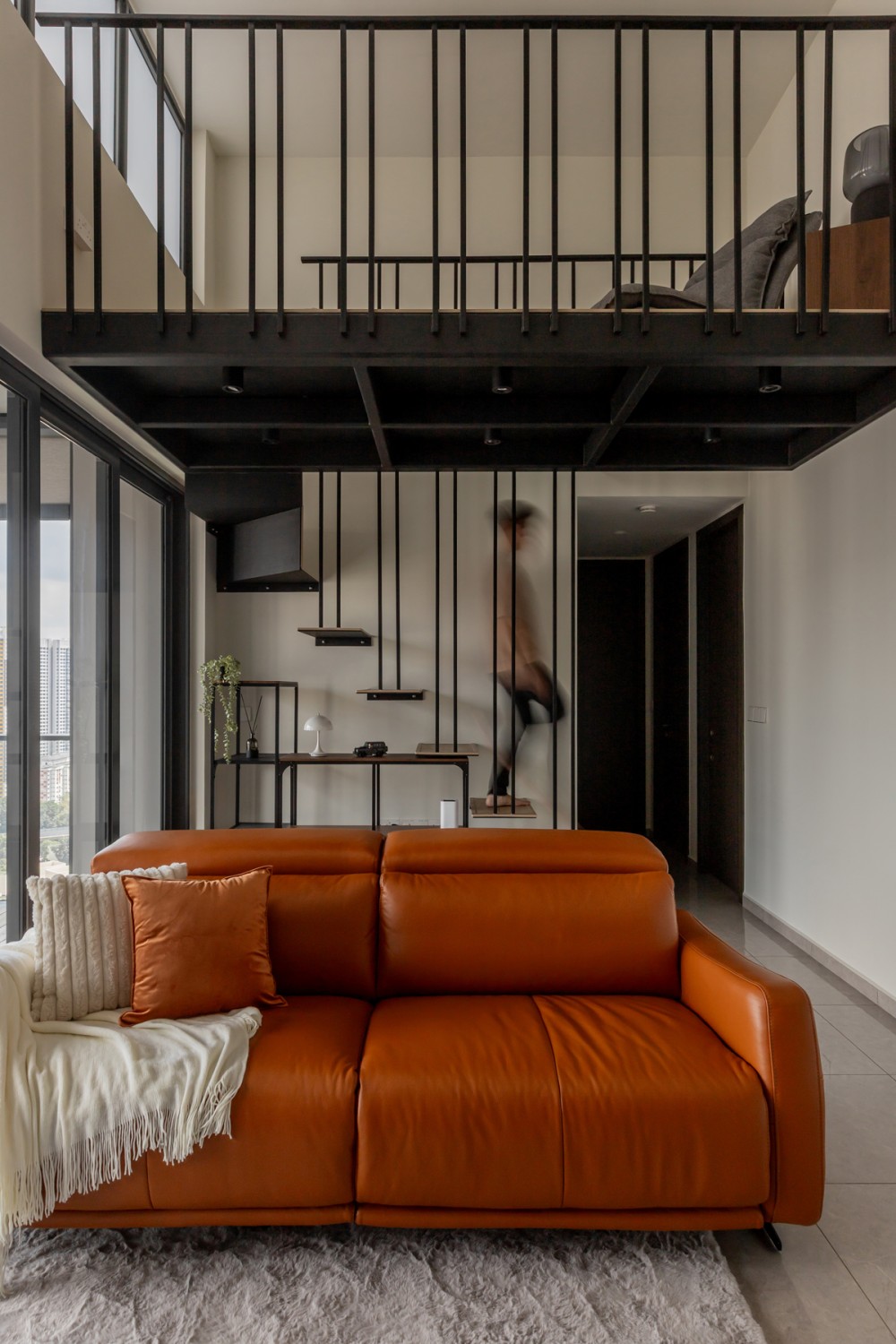 Modern Living Room with Staircase and Glass Door
