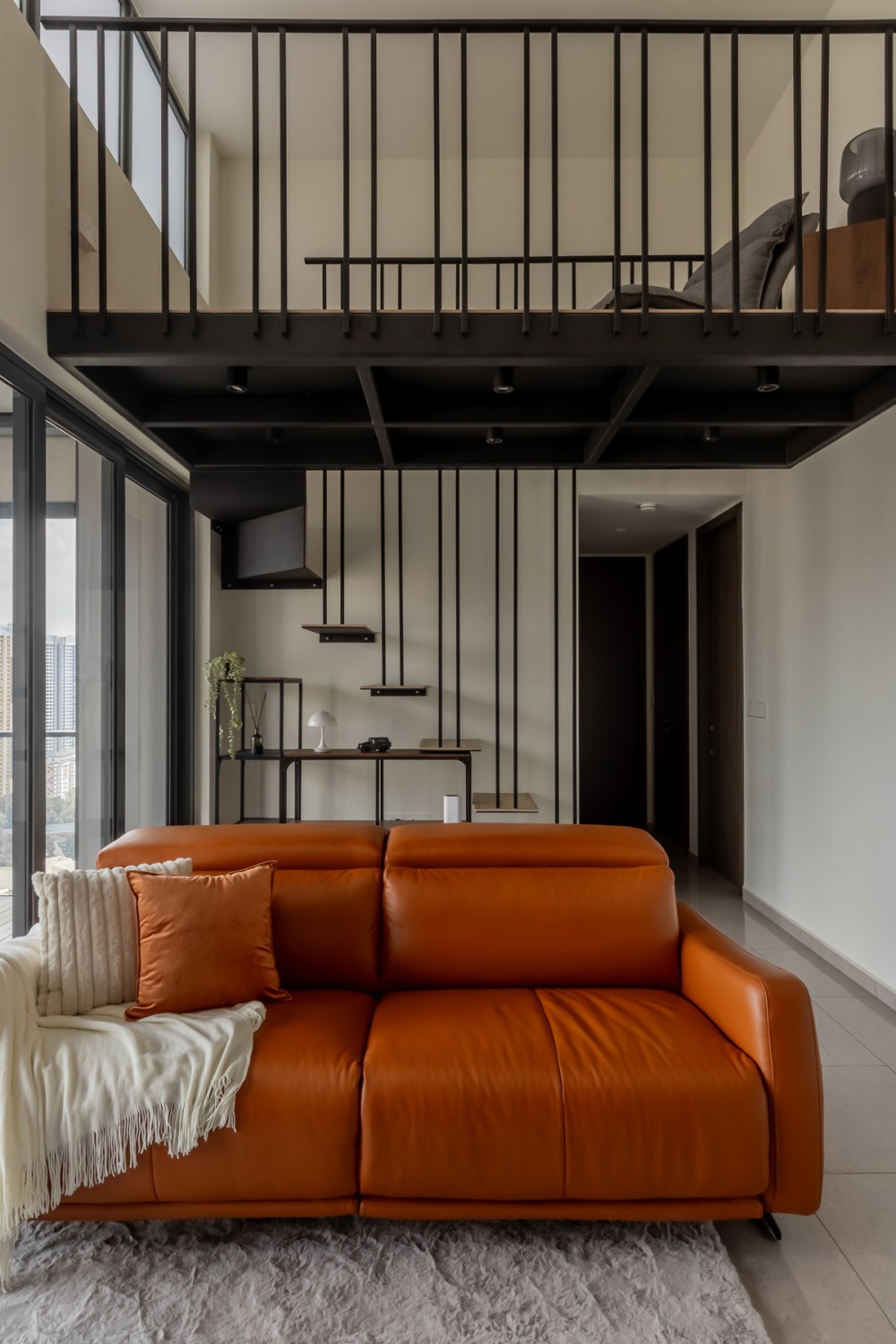 Modern Living Room with Staircase and Glass Door