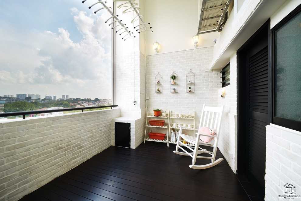 Minimalist Balcony with Window Shutters and Outdoor Table
