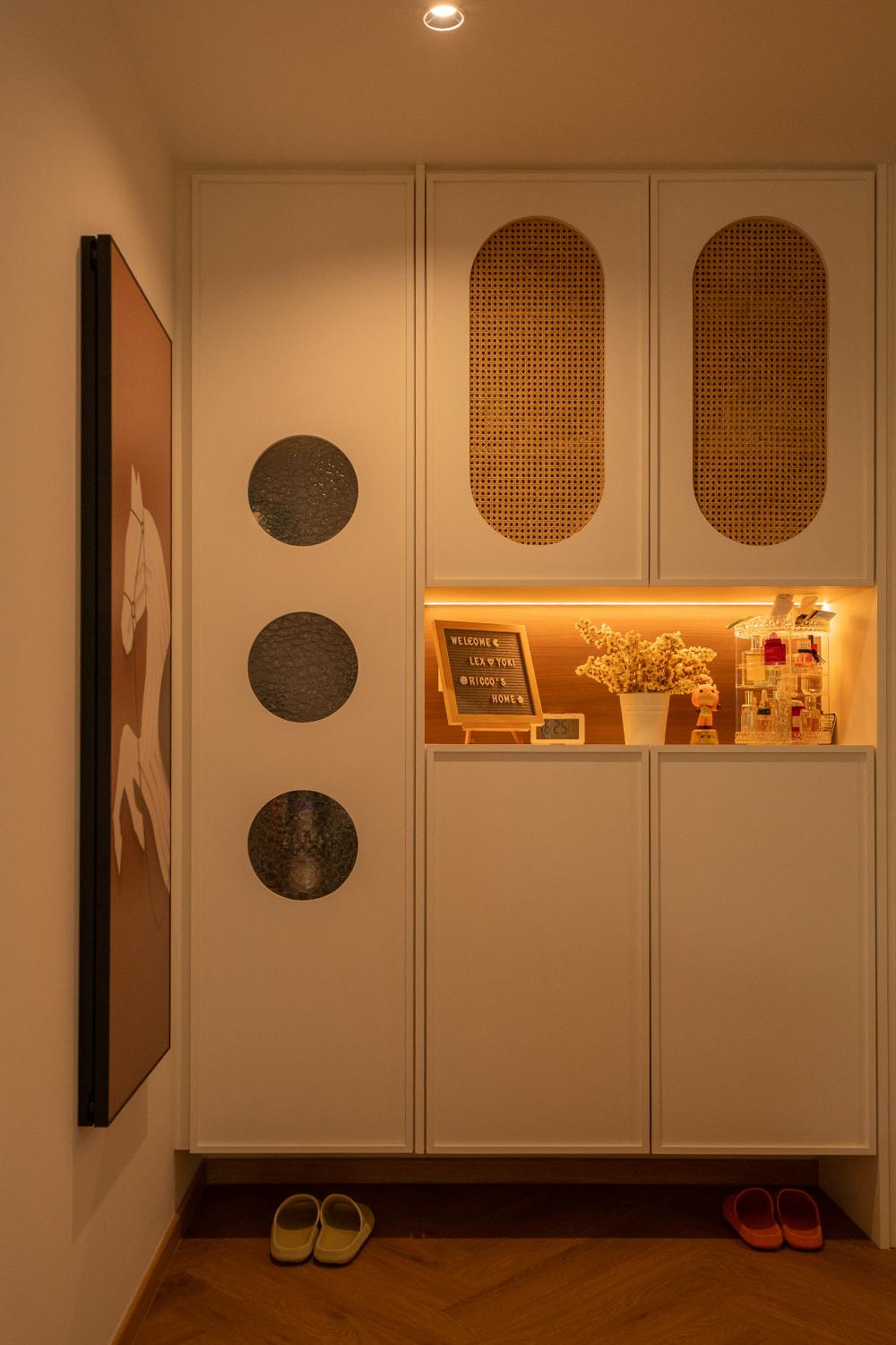 Modern Foyer with Artwork and Storage Cabinets