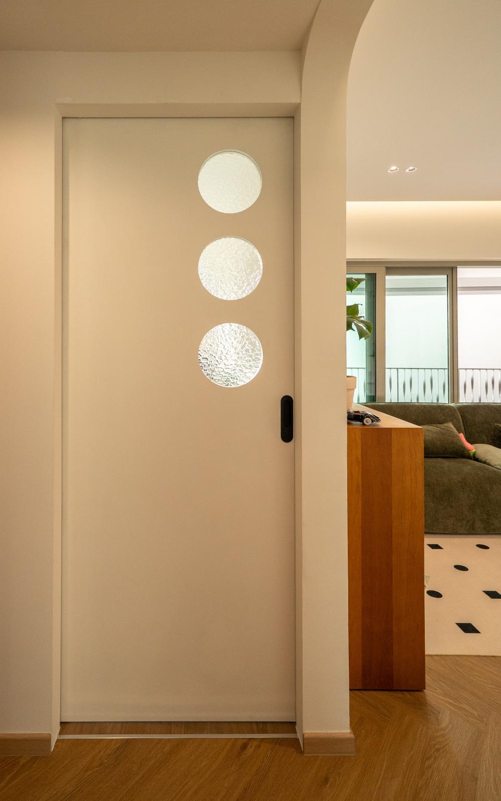 Modern Hallway with Artwork and Glass Door