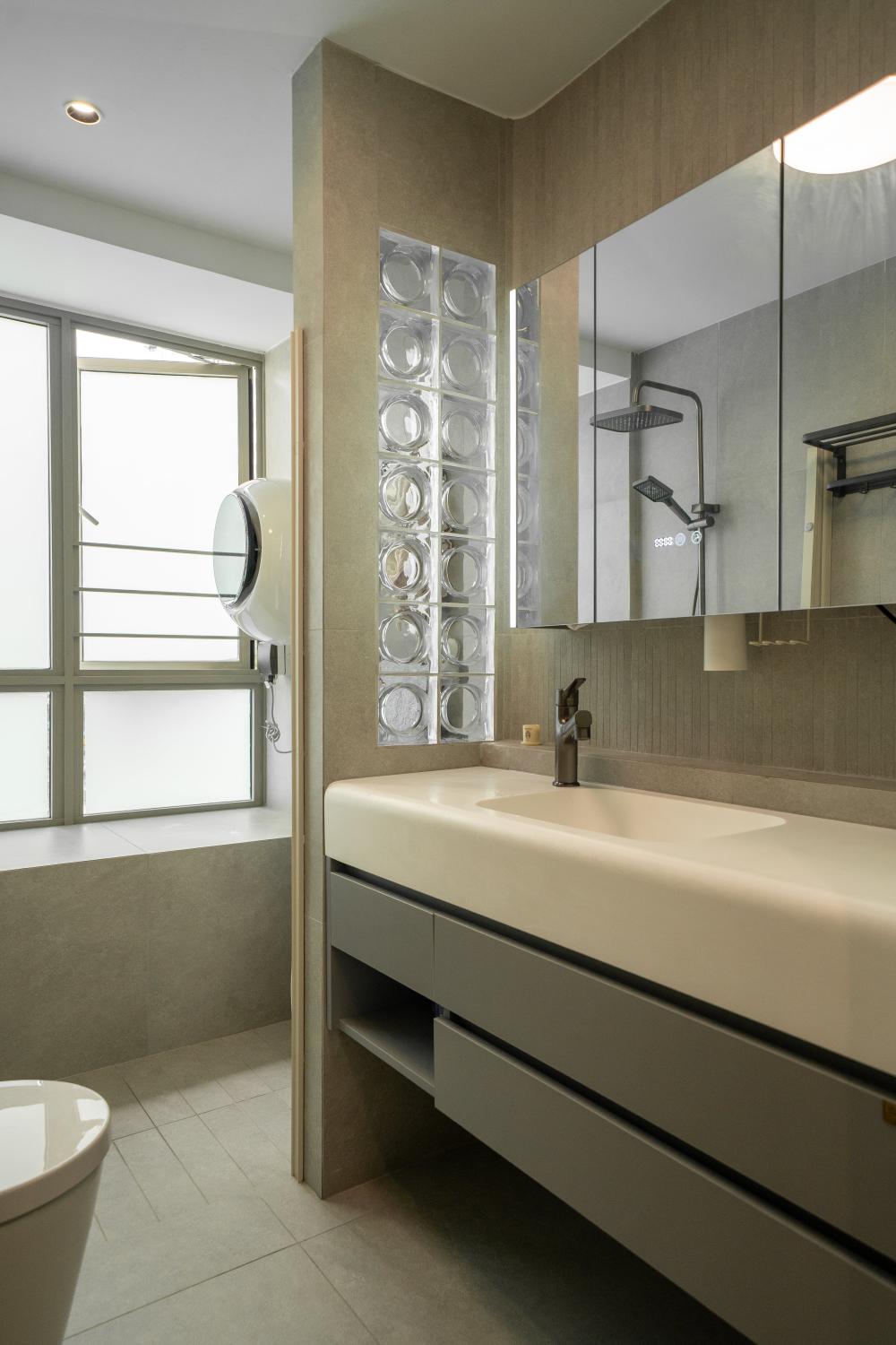 Modern Bathroom with Herringbone Tiling and Mirror